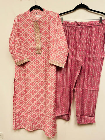 RFSS769 - Muslin Silk Patola print Kurti in Baby Pink with Sequin Work on Yoke. Comes with Lavendar color printed Pants
