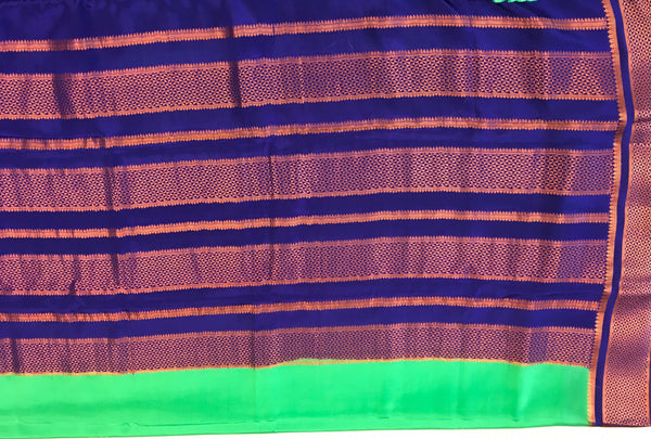 AMS1013 Pure Mysore Crepe silk Saree in green color with blue copper zari border. Comes with unstitched blouse.