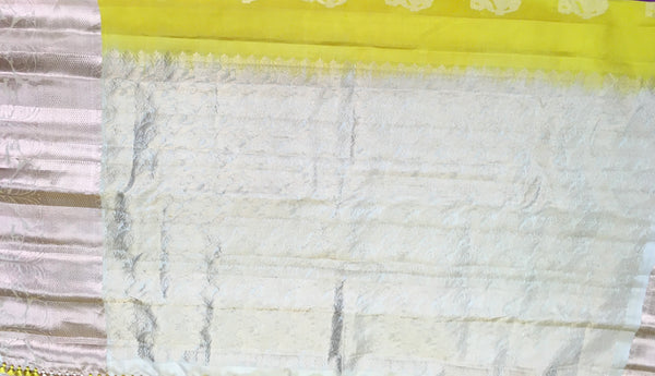 KSS461 Pure handloom kanchipuram silk Saree in yellow with white gold zari border.comes with stitched blouse size 40,can be altered to 44 size.