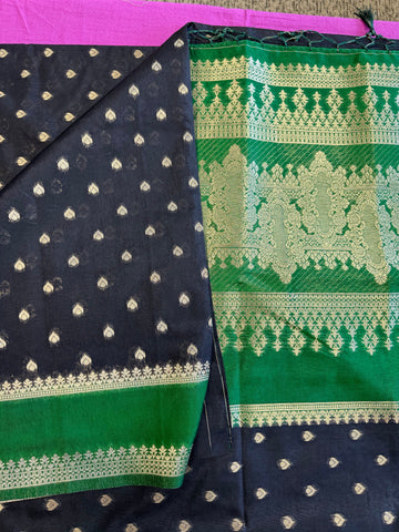 Banarasi Munga silk  saree in black  with Green border. Fall peco done. Comes with stitched blouse size 38 can be altered up to 44 size.