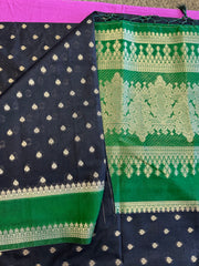 Banarasi Munga silk  saree in black  with Green border.Fall peco done. Comess with stitched blouse size 38 can be altered up to 44 size.