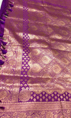 BKS115 Banarasi Mashru silk Saree in purple. Comes with gold zari work. Comes with stitched blouse size 38 can be altered to size 42. Fall peco done.