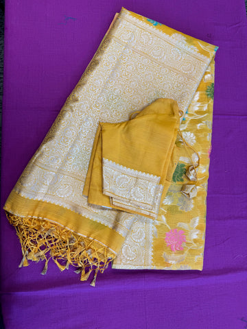 Banarasi Tussari saree in Yellow with gold  zari border.Fall peco done. Comess with stitched blouse size 38 can be altered up to 44 size.