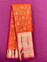 KSS432 Pure kanchipuram tissue silk Saree in orange with pink gold zari border .comes with stitched blouse size 40,can be altered to 44 size.