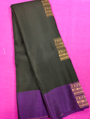 KSS438 kanchipuram silk Saree in black with purple gold zari border.comes with stitched blouse size 40,can be altered to 44 size.