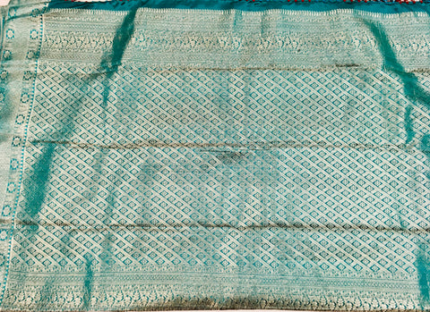 KSS508 Pure kanchipuram handloom silk Saree in maroon with teal color and silver zari border. comes with stitched blouse size 40,can be altered to 44 size.
