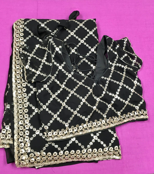 AFL3067 Partywear saree in black Georgette fabric with silver sequins embroidery.Come with stitched blouse size 40,can be altered to 44 size.Fall peco done.