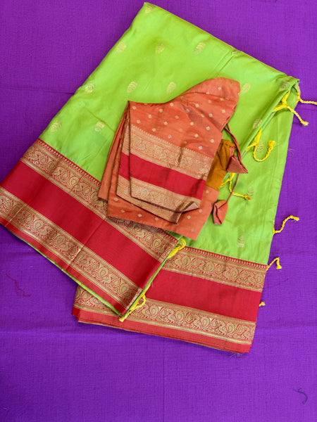 Semi kanjivaram soft silk Saree in Green with Orange border.Fall peco done. Comess with stitched blouse size 38 can be altered up to 44 size.