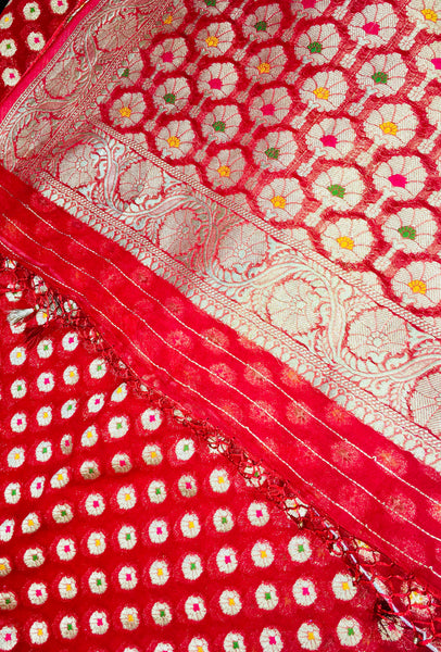 BKS102 Banarasi Georgette saree in red. Comes with stitched blouse size 38 can be altered to size 42. Fall peco done.