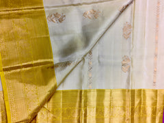 KSS456 Pure handloom kanchipuram silk Saree in sandal yellow with yellow gold zari border.comes with stitched blouse size 40,can be altered to 44 size.