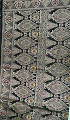 BKS132 Banarasi Mashru silk Saree in black. Comes with gold  zari work. Comes with stitched blouse size 38 can be altered to size 42. Fall peco done.