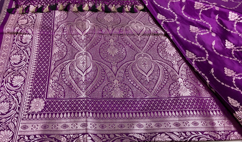 BKS130 Banarasi Mashru silk Saree in purple. Comes gold zari work. Comes with stitched blouse size 38 can be altered to size 42. Fall peco done.