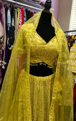 AFL4002 Wedding lehenga in yellow comes with heavy embroidery and sequin work.comes with net dupatta and stitched blouse.