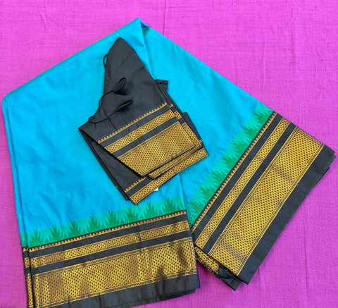 Korvai silk cotton saree in Blue with black border. Fall peco done. Comes with stitched blouse size 38 can be altered up to 44 size.