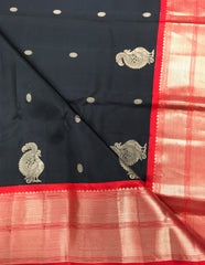 KSS428 Pure handloom kanchipuram silk Saree in black with red gold zari border.comes with stitched blouse size 40,can be altered to 44 size.