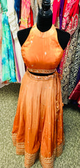 AFL9033 lehenga in orange . Comes with matching stitched blouse and dupatta.