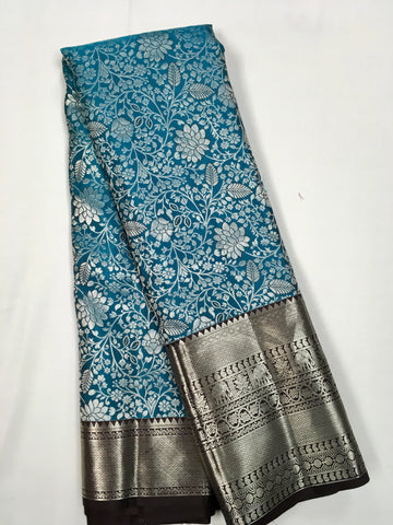 KSS505 Pure kanchipuram tissue silk Saree in blue with brown color gold zari border. comes with stitched blouse size 40,can be altered to 44 size.
