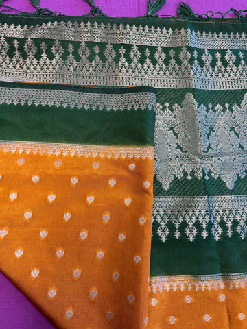 Banarasi Munga silk  saree in yellow  with Bottle Green border.Fall peco done. Comess with stitched blouse size 38 can be altered up to 44 size.