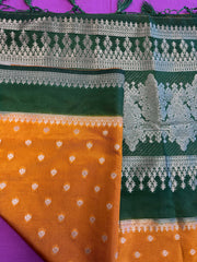 Banarasi Munga silk  saree in yellow  with Bottle Green border.Fall peco done. Comess with stitched blouse size 38 can be altered up to 44 size.