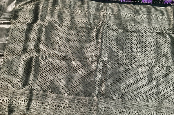 KSS506 Pure kanchipuram tissue silk Saree in purple color with bottle green color gold zari border. comes with stitched blouse size 40,can be altered to 44 size.