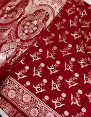 BKS121 Banarasi Mashru silk Saree in maroon. comes with gold zari work. Comes with stitched blouse size 38 can be altered to size 42. Fall peco done.