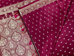 BKS126 Banarasi Mashru silk Saree in wine. Comes with gold  zari work. Comes with stitched blouse size 38 can be altered to size 42. Fall peco done.