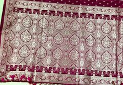 BKS126 Banarasi Mashru silk Saree in wine. Comes with gold  zari work. Comes with stitched blouse size 38 can be altered to size 42. Fall peco done.