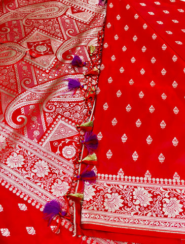 BKS116 Banarasi Mashru silk Saree in red.Comes with gold zari work. Comes with stitched blouse size 38 can be altered to size 42. Fall peco done.