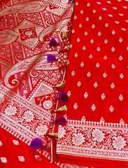 BKS116 Banarasi Mashru silk Saree in red.Comes with gold zari work. Comes with stitched blouse size 38 can be altered to size 42. Fall peco done.