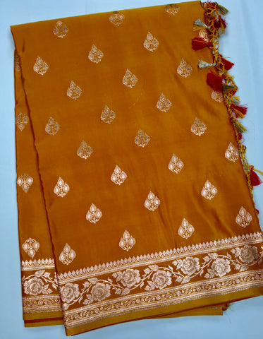 BKS119 Banarasi Mashru silk Saree in yellow. Comes with gold zari work. Comes with stitched blouse size 38 can be altered to size 42. Fall peco done.