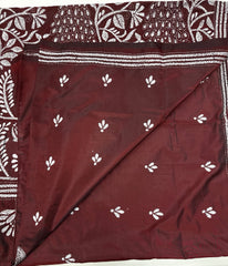 KSN209: Semi Silk Kantha Tusser Saree in maroon hand work design. Fall Peco done. Comes with stitched Blouse size 38 it can be altered to 44 size.