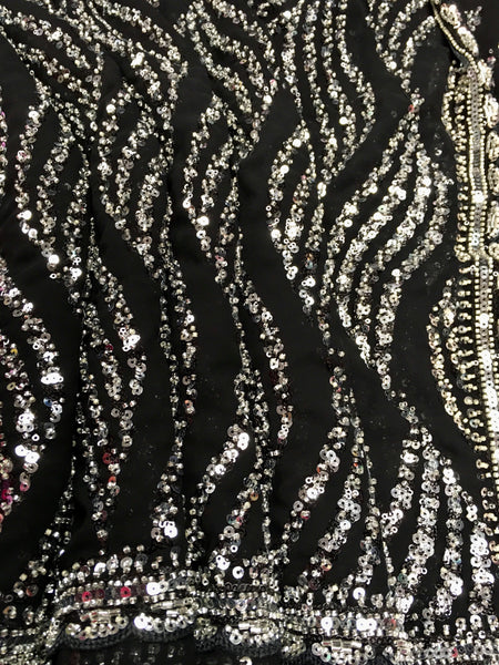 AFL3074 Party Wear saree with bead and sequin work in Black.Comes with stitched blouse size 38 ,can be altered to 42. Fall peco done.