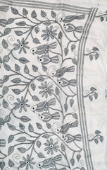 KSN211 Semi Silk Kantha Tusser Saree in white hand work design. Comes with stitched Blouse.