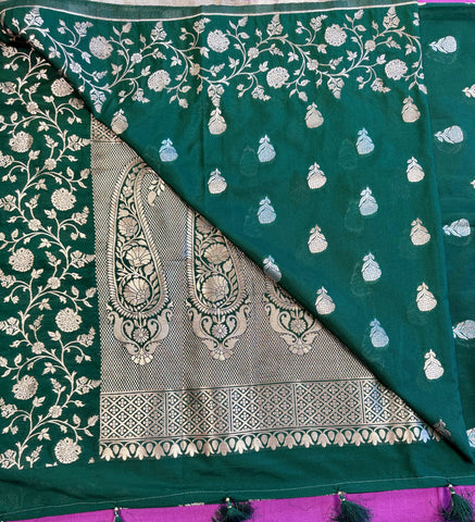 semi silk banarasi Saree in Bottle Green with Gold Zari Border. Fall peco done. Comes  with stitched blouse size 38 can be altered up to 44