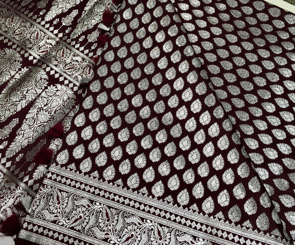 BKS125 Banarasi Mashru silk Saree in brown. Comes with silver zari work. Comes with stitched blouse size 38 can be altered to size 42. Fall peco done.