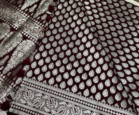 BKS125 Banarasi Mashru silk Saree in brown. Comes with silver zari work. Comes with stitched blouse size 38 can be altered to size 42. Fall peco done.