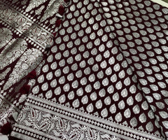 BKS125 Banarasi Mashru silk Saree in brown. Comes with silver zari work. Comes with stitched blouse size 38 can be altered to size 42. Fall peco done.