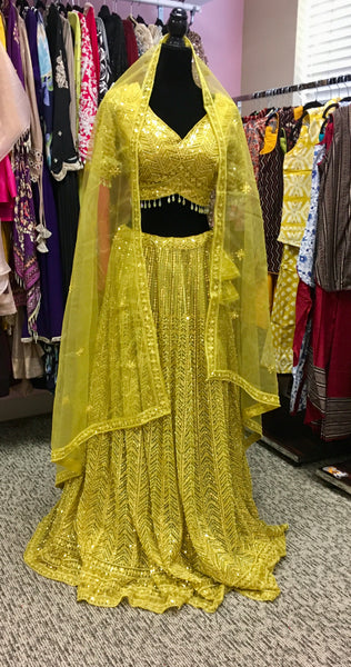 AFL4002 Wedding lehenga in yellow comes with heavy embroidery and sequin work.comes with net dupatta and stitched blouse.