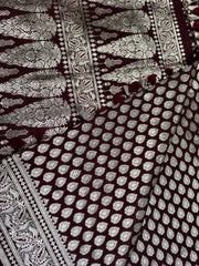 BKS125 Banarasi Mashru silk Saree in brown. Comes with silver zari work. Comes with stitched blouse size 38 can be altered to size 42. Fall peco done.