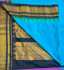 Korvai silk cotton saree in Blue with black border. Fall peco done. Comes with stitched blouse size 38 can be altered up to 44 size.