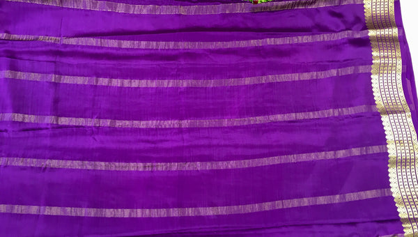 AMS1021 Pure Mysore Crepe silk Saree in green color with purple gold zari border. Comes with unstitched blouse.
