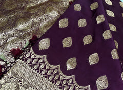 BKS127 Banarasi Mashru silk Saree in brown. Comes with gold zari work. Comes with stitched blouse size 38 can be altered to size 42. Fall peco done.