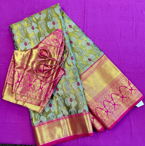 Semi Silk Saree in green with pink Gold zari border. Comes with stitched blouse size 38 can be altered up to 44