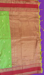 Semi kanjivaram soft silk Saree in Green with Orange border. Fall peco done. Comes with stitched blouse size 38 can be altered up to 44 size.