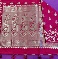 semi silk banarasi Saree in Rani Pink  with Gold  Zari Border. Fall peco done. Comes with stitched blouse size 38 can be altered up to 44