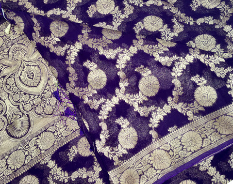 BKS112 Banarasi Georgette saree in purple. Comes with stitched blouse size 38 can be altered to size 42. Fall peco done.