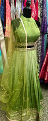 AFL9036 lehenga in green . Comes with matching stitched blouse and dupatta.