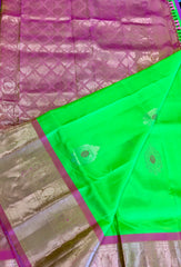 Pure kanchipuram Handloom Silk Saree in Parrot Green with Light Pink Zari border. Comess with Stitched Blouse size 38 can be altered up to 44