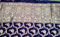 BKS112 Banarasi Georgette saree in purple. Comes with stitched blouse size 38 can be altered to size 42. Fall peco done.