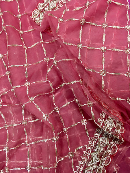 AFL3070 Partywear net saree in pink with silver bead and sequin embroidery.Comes with stitched blouse size 40,can be altered to 44 size.Fall peco done.